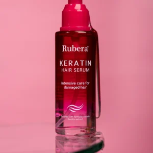 100ml bottle of keratin-infused hair serum with an eye-catching red bottle and pump, designed for repairing damaged hair and enhancing hair strength. A leading product from an effective, affordable skincare brand.