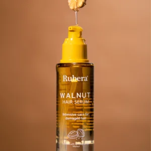 100ml bottle of shine-boosting walnut hair serum with a golden designed bottle, adding natural shine and luster to hair, an effective product from the best affordable skincare brands.