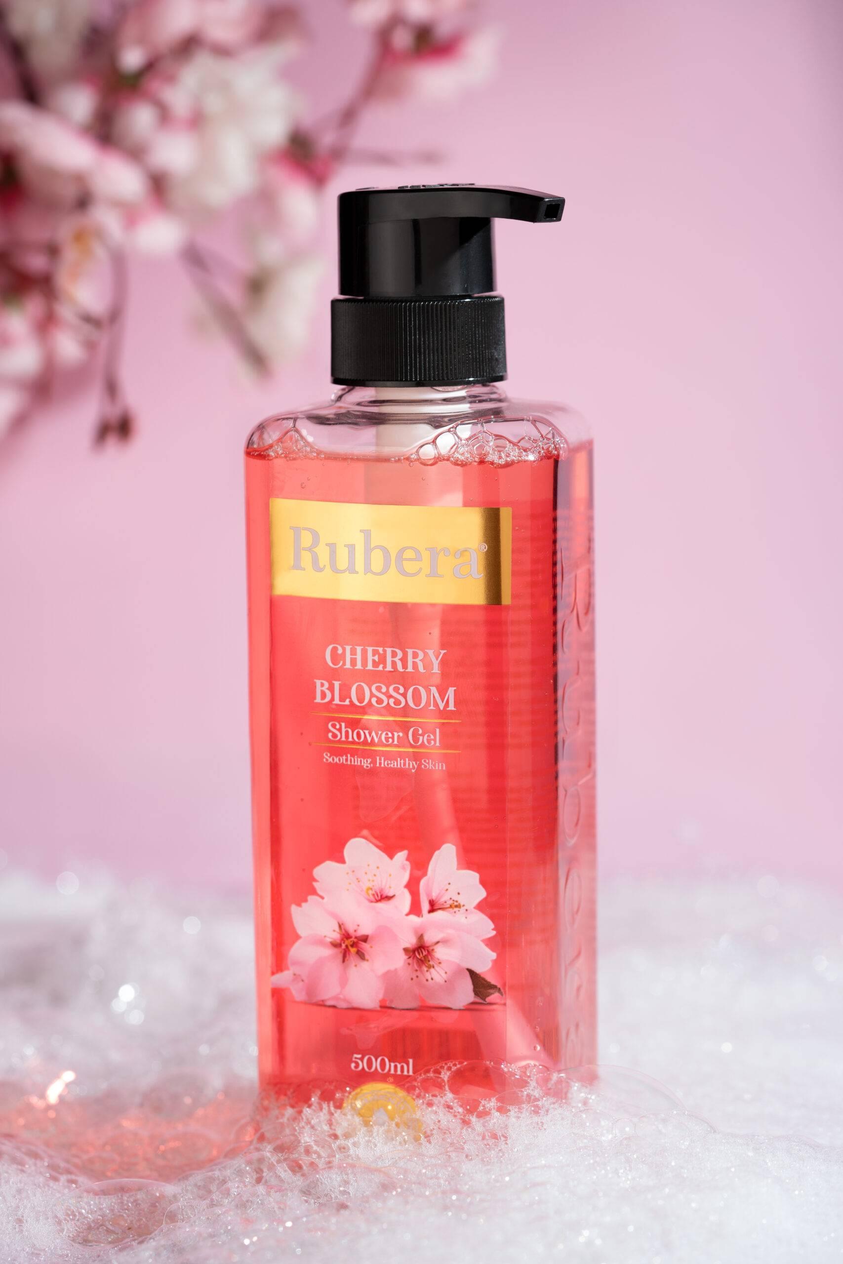 Cherry Blossom Shower Gel 1 Rubera Cherry Blossom Shower Gel – 1000ml bottle with a floral cherry blossom-themed label, placed against a soft pink background with cherry blossoms in the frame.