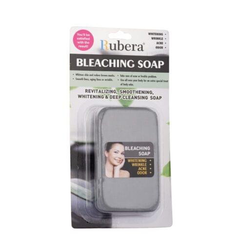 Rubera Bleaching Soap packaging with product benefits and usage instructions. The packaging highlights whitening, wrinkle reduction, acne care, and odor removal, with text in both English and Arabic.