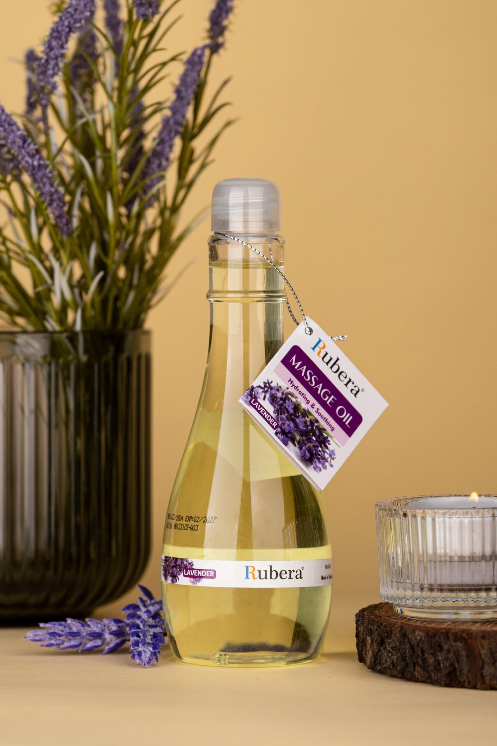 Lavender Massage Oil (125ml) 1 Rubera Rosemary Massage Oil – Hydrating and soothing massage oil in a transparent bottle with a silver cap, featuring a rosemary label and a hanging product tag.